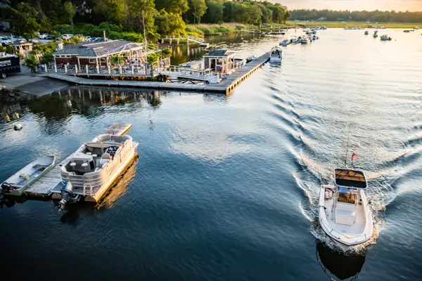 A boat heading out of Green Harbor in golden light